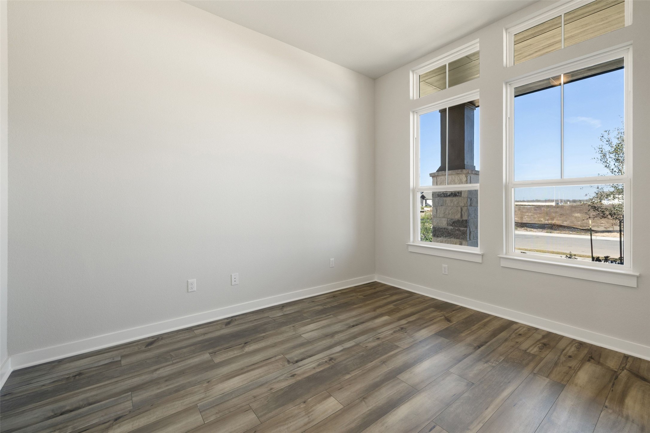 16309 Smithers Road Manor, TX 78653 - Photo 4 of 40 a view of a room with wooden floor and windows