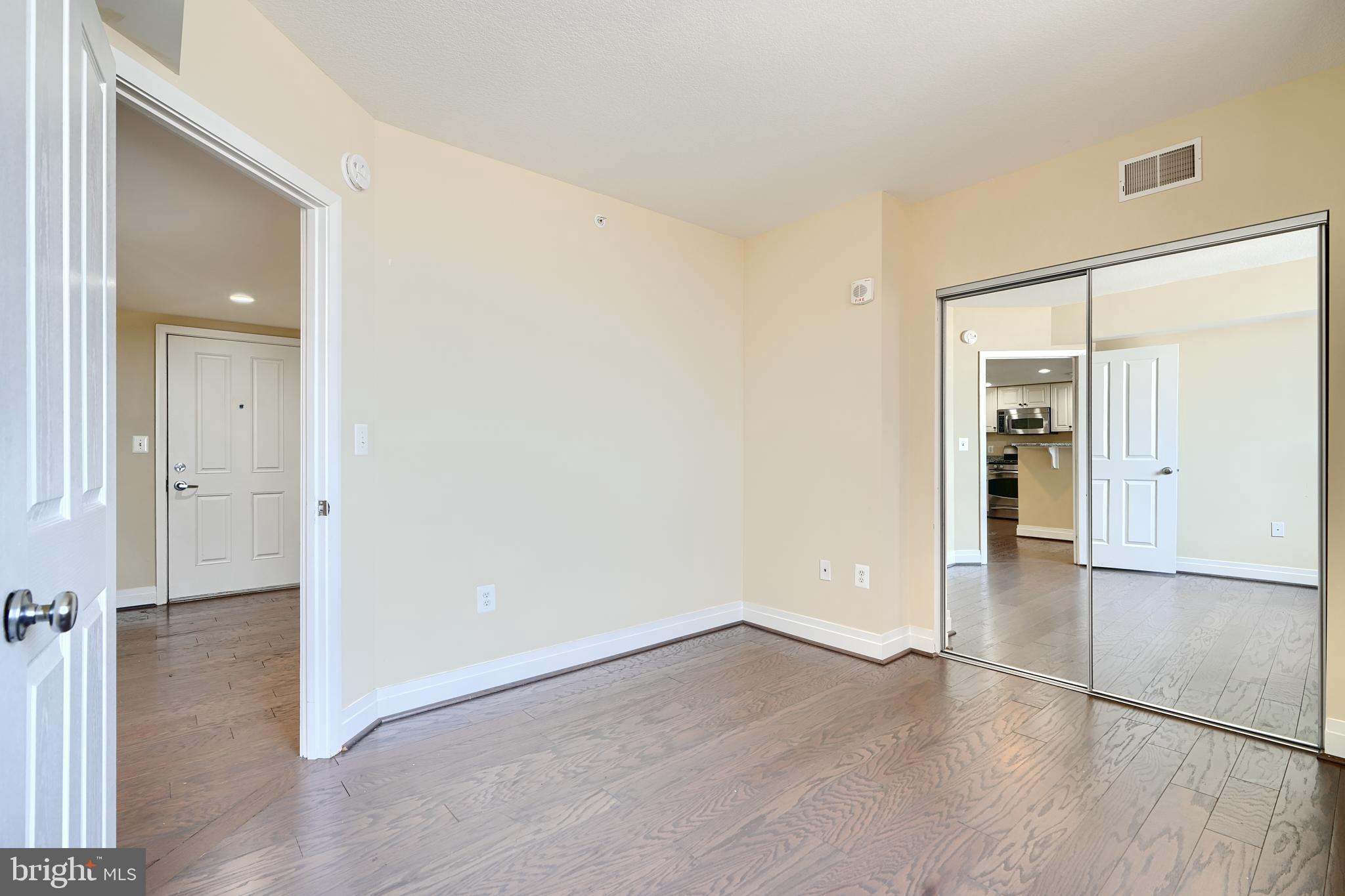414 Water Street, Unit 1513 Baltimore, MD 21202 - Photo 16 of 43 wooden floor in an empty room