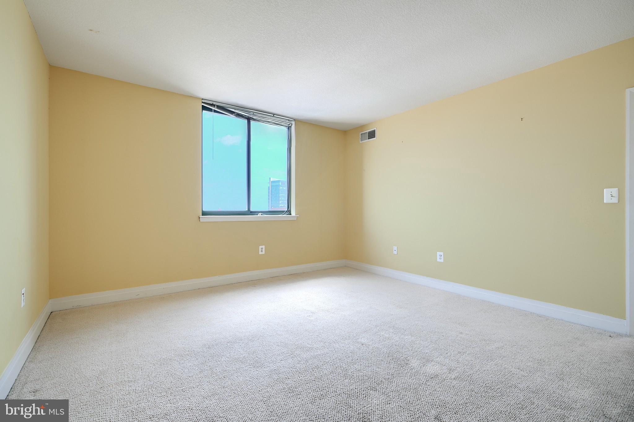 414 Water Street, Unit 1513 Baltimore, MD 21202 - Photo 19 of 43 an empty room with a window