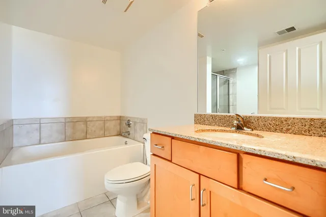 a bathroom with white bathtub