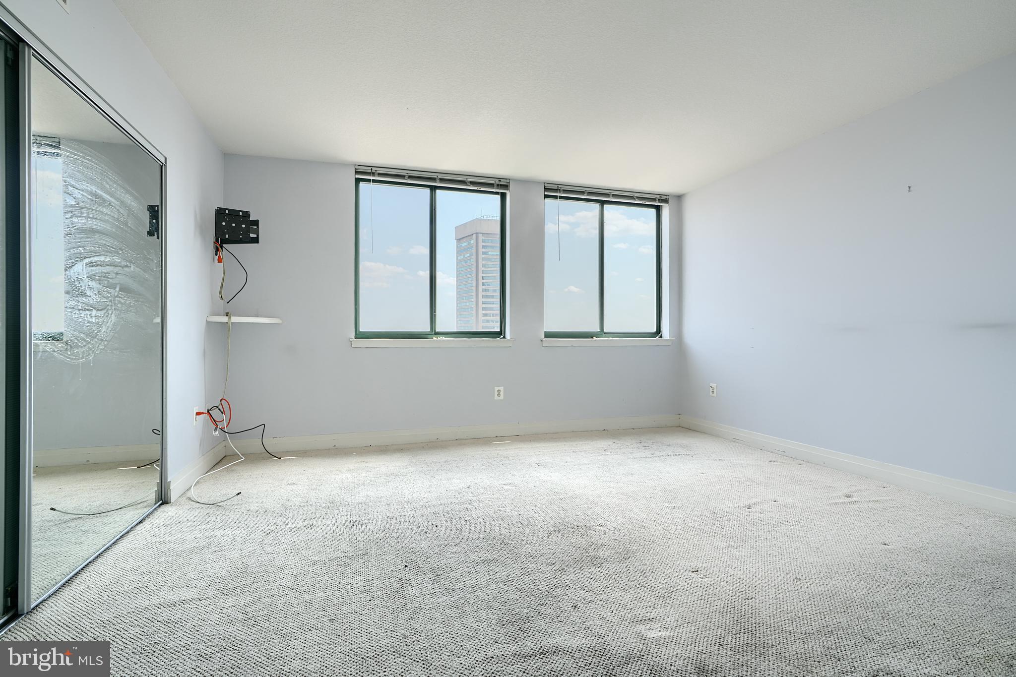 414 Water Street, Unit 1513 Baltimore, MD 21202 - Photo 29 of 43 an empty room with windows