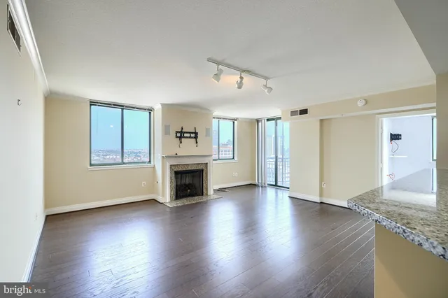 a kitchen with stainless steel appliances a stove top oven and refrigerator