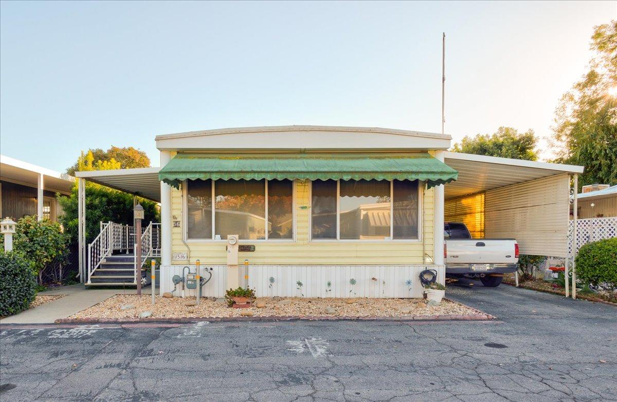 a front view of a house with a porch