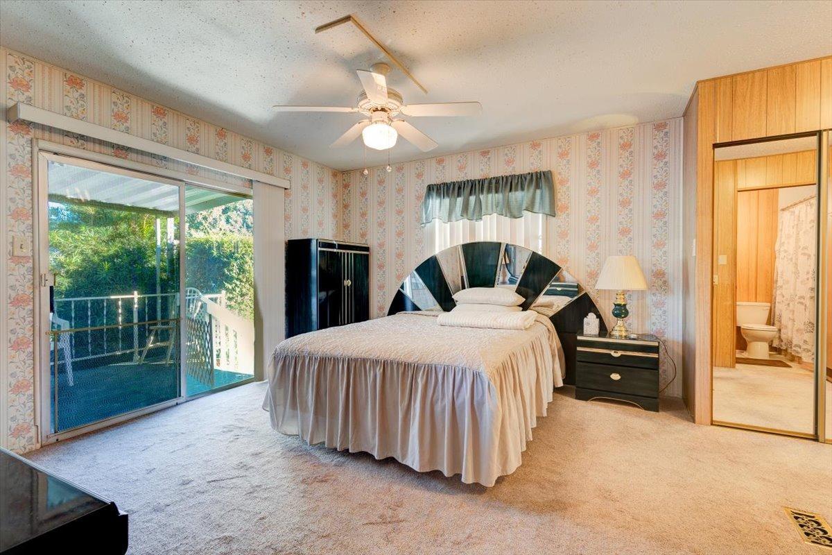 1272 Villa Avenue, Unit SPC56 Clovis, CA 93612 - Photo 15 of 35 a bedroom with a bed and a large window