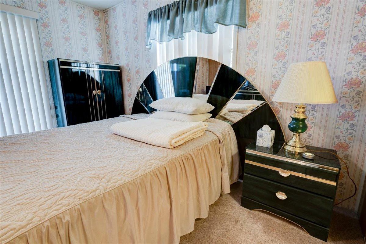1272 Villa Avenue, Unit SPC56 Clovis, CA 93612 - Photo 19 of 35 a bedroom with a bed and dresser