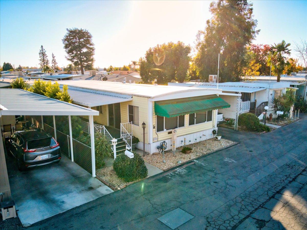 1272 Villa Avenue, Unit SPC56 Clovis, CA 93612 - Photo 2 of 35 a view of a house with backyard and sitting area