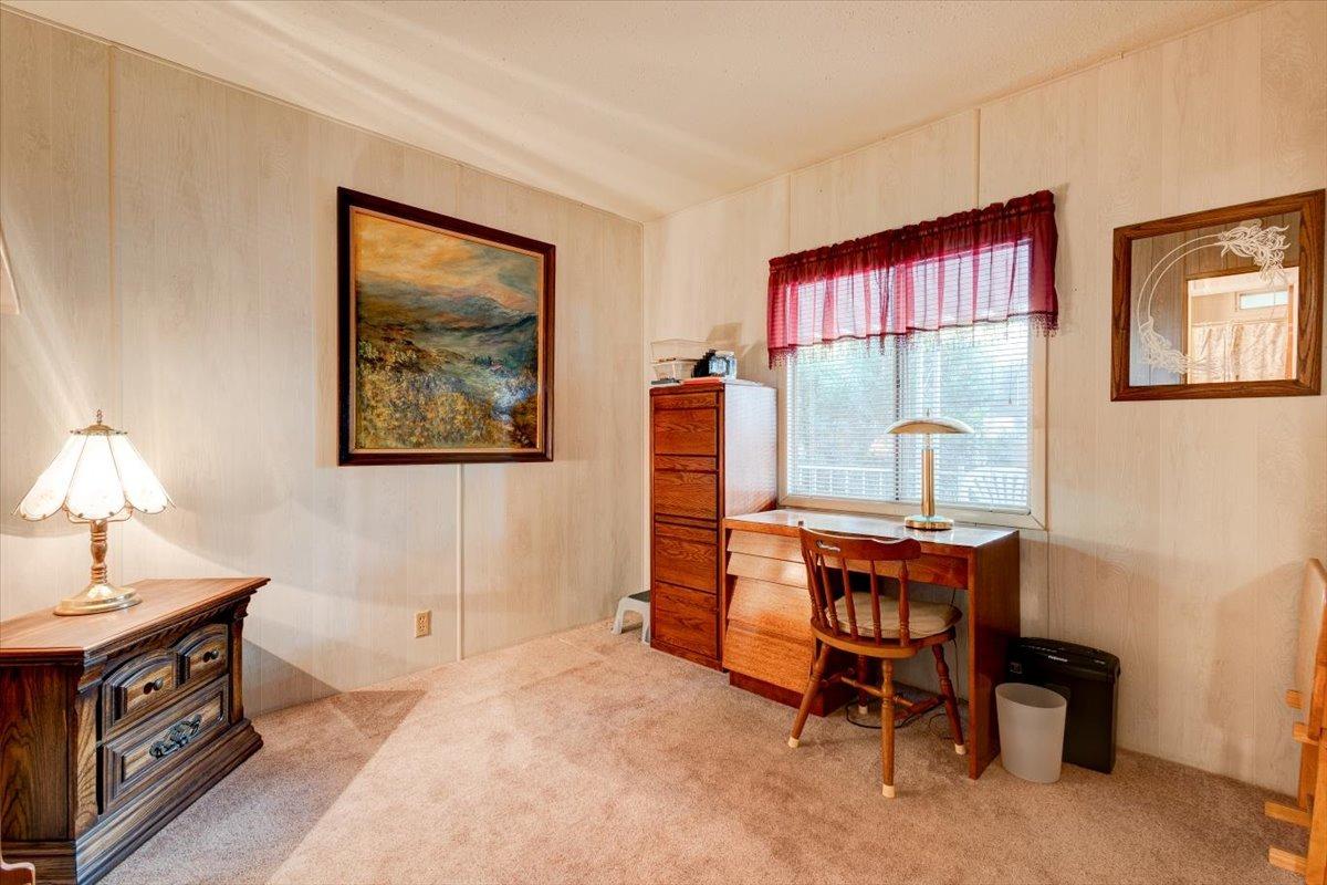 1272 Villa Avenue, Unit SPC56 Clovis, CA 93612 - Photo 22 of 35 a view of a workspace with furniture and a window