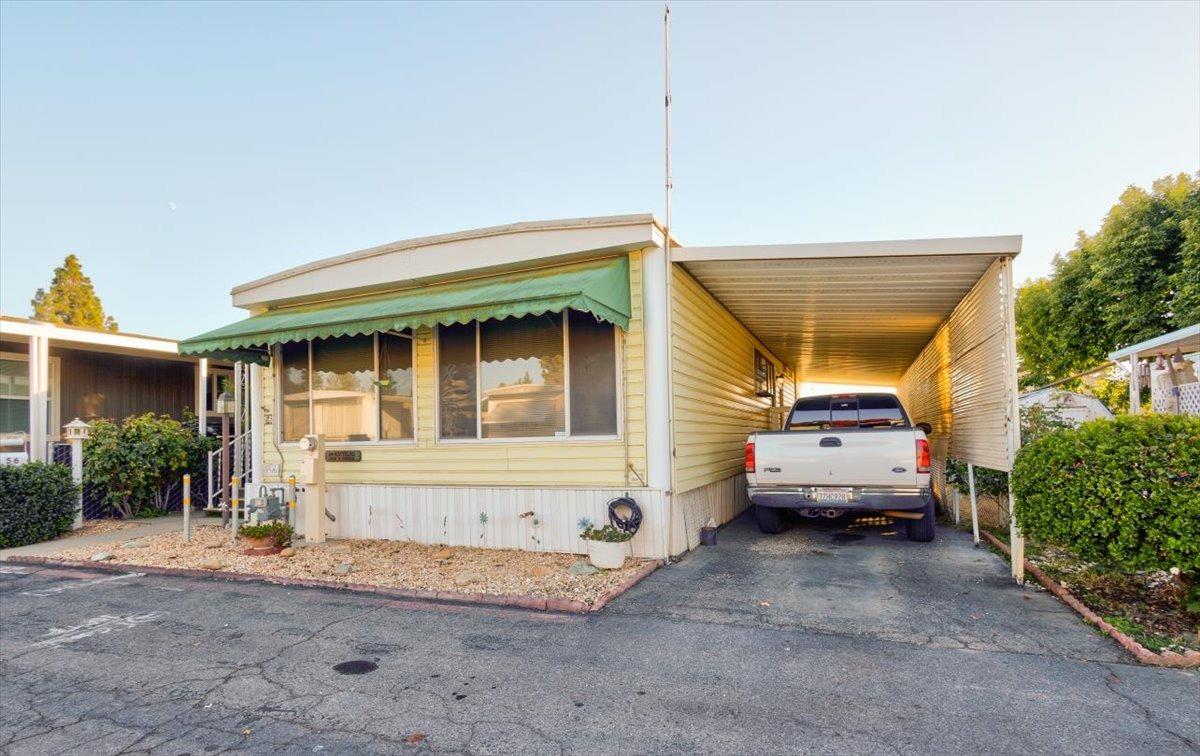 1272 Villa Avenue, Unit SPC56 Clovis, CA 93612 - Photo 26 of 35 a view of a car park in front of house