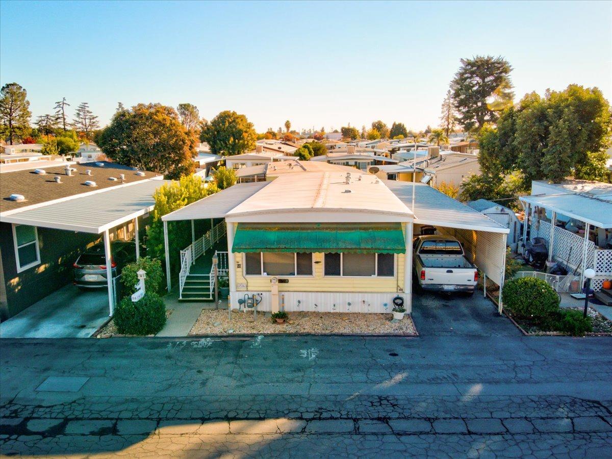 1272 Villa Avenue, Unit SPC56 Clovis, CA 93612 - Photo 27 of 35 a view of a house with a yard