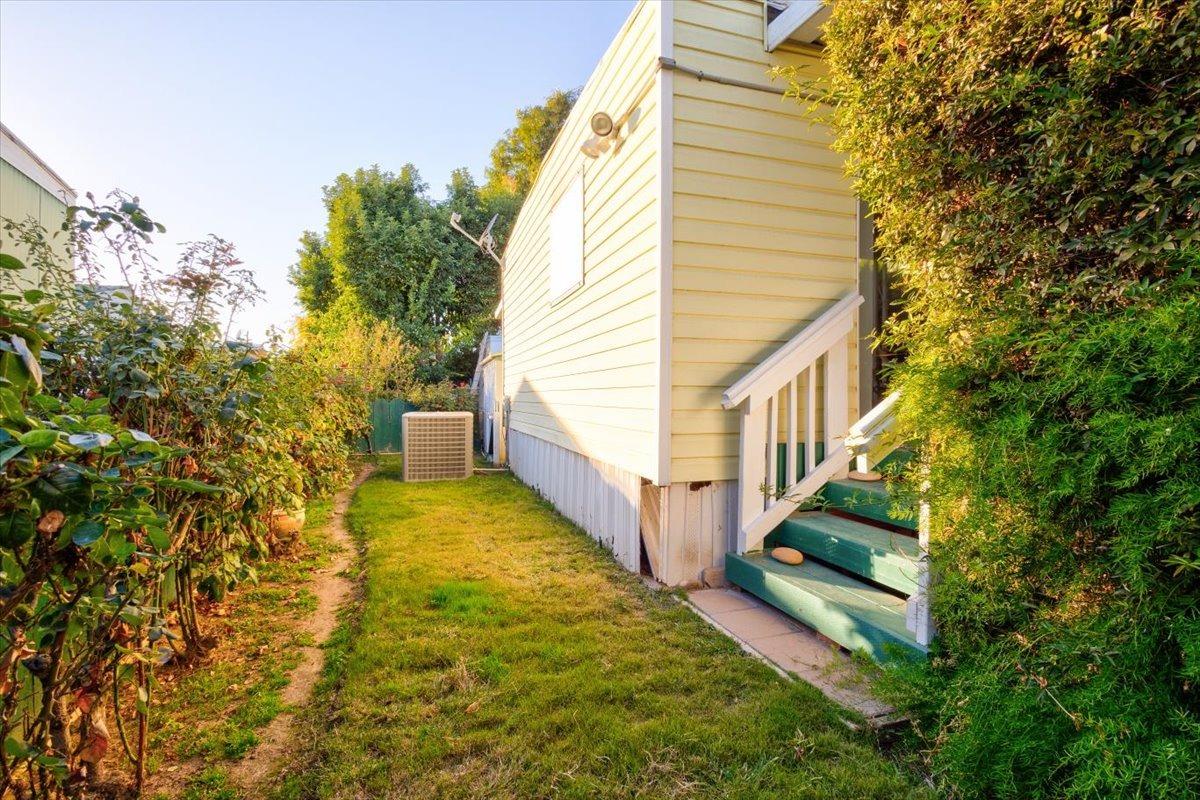 1272 Villa Avenue, Unit SPC56 Clovis, CA 93612 - Photo 3 of 35 a view of house with backyard and trees