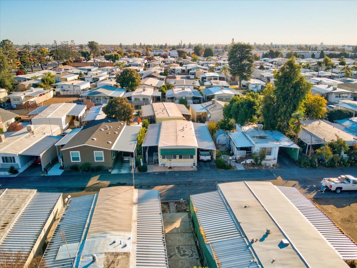 1272 Villa Avenue, Unit SPC56 Clovis, CA 93612 - Photo 31 of 35 an aerial view of a house with garden space and street view