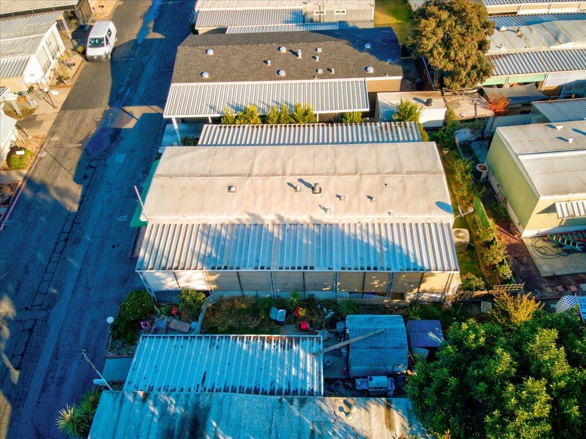 1272 Villa Avenue, Unit SPC56 Clovis, CA 93612 - Photo 33 of 35 swimming pool with potted plants and wooden fence