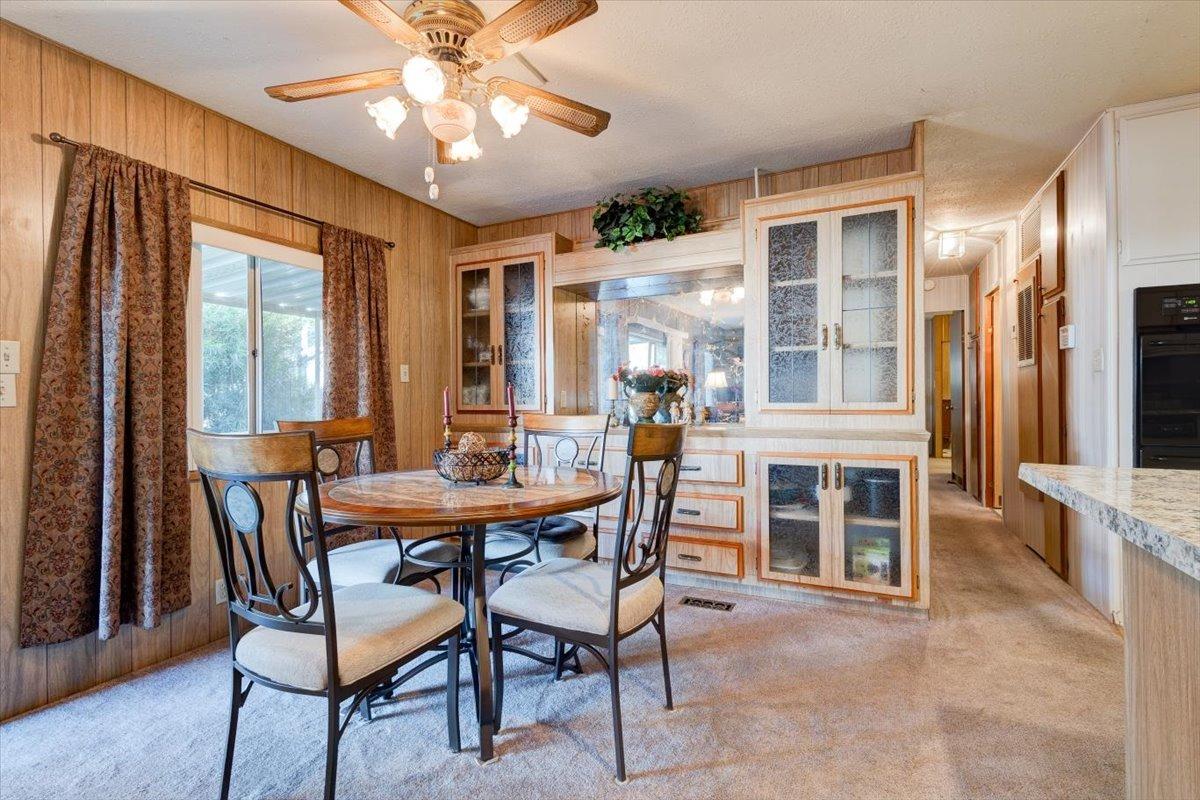 1272 Villa Avenue, Unit SPC56 Clovis, CA 93612 - Photo 9 of 35 a dining room with furniture window and wooden floor