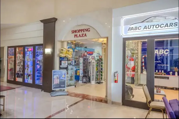 a kitchen with granite countertop a sink and a stove top oven