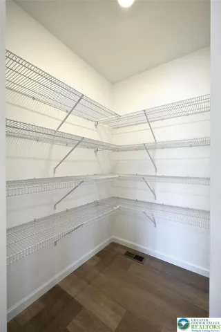 a view of an empty walk in closet