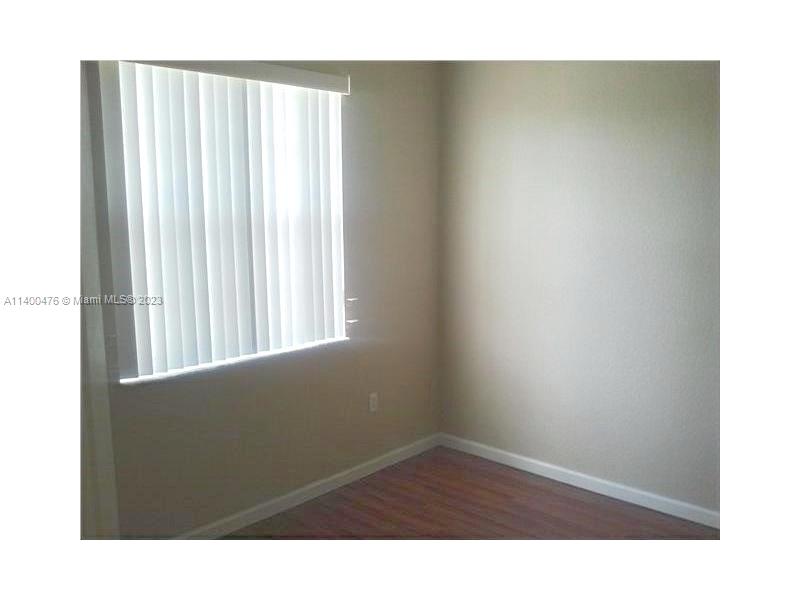 8436 Southwest 29th Street, Unit 101 Miramar, FL 33025 - Photo 14 of 21 a room with a window