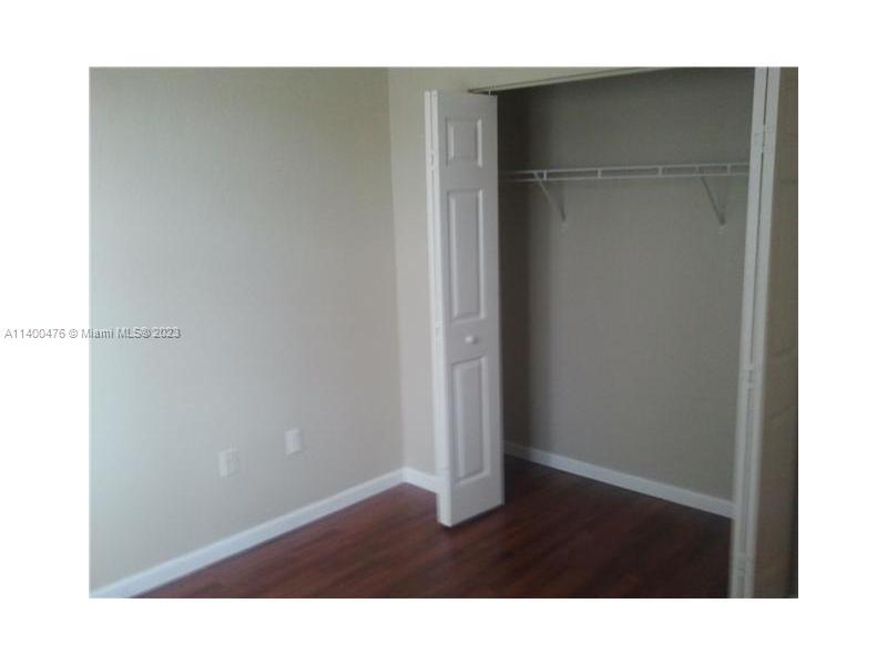 8436 Southwest 29th Street, Unit 101 Miramar, FL 33025 - Photo 15 of 21 a room with a wooden door