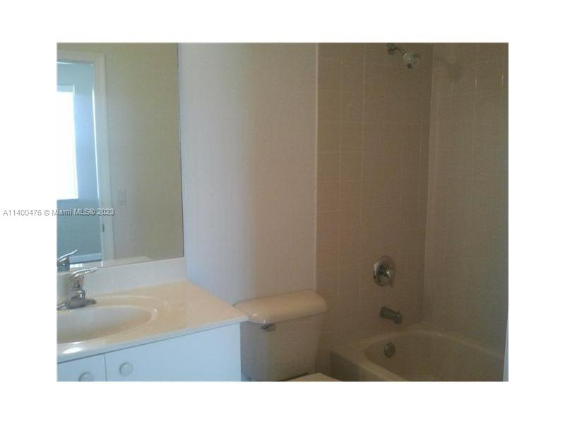 8436 Southwest 29th Street, Unit 101 Miramar, FL 33025 - Photo 16 of 21 a bathroom with a sink and a shower