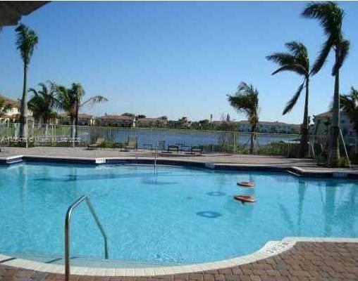 8436 Southwest 29th Street, Unit 101 Miramar, FL 33025 - Photo 18 of 21 a view of a swimming pool and lake view