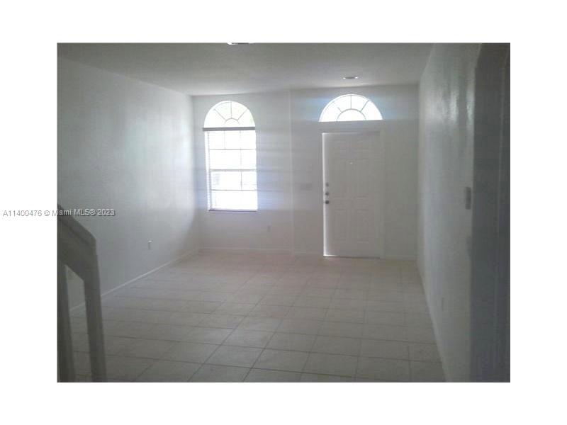 8436 Southwest 29th Street, Unit 101 Miramar, FL 33025 - Photo 3 of 21 a bathroom with double door