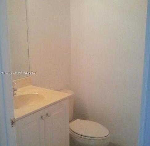 8436 Southwest 29th Street, Unit 101 Miramar, FL 33025 - Photo 7 of 21 a bathroom with a sink a toilet and vanity