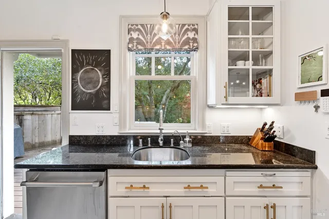 a kitchen with a sink and a window