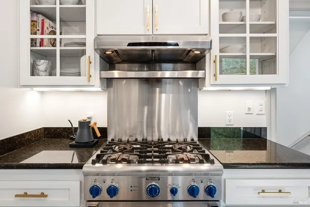 a kitchen with a stove and a microwave