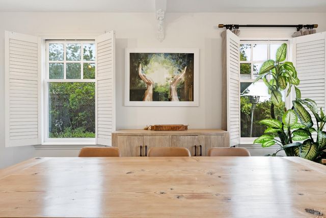 a bathroom with a tub and window