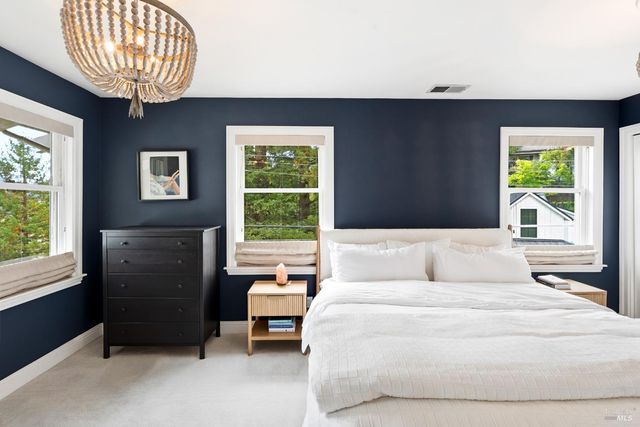 a bed room with a bed and a window