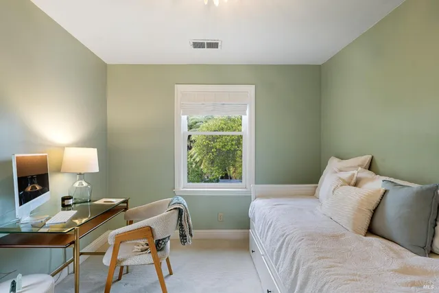 a work room with furniture and a window