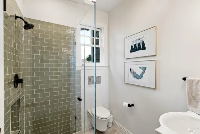 a bathroom with a sink a mirror and a shower