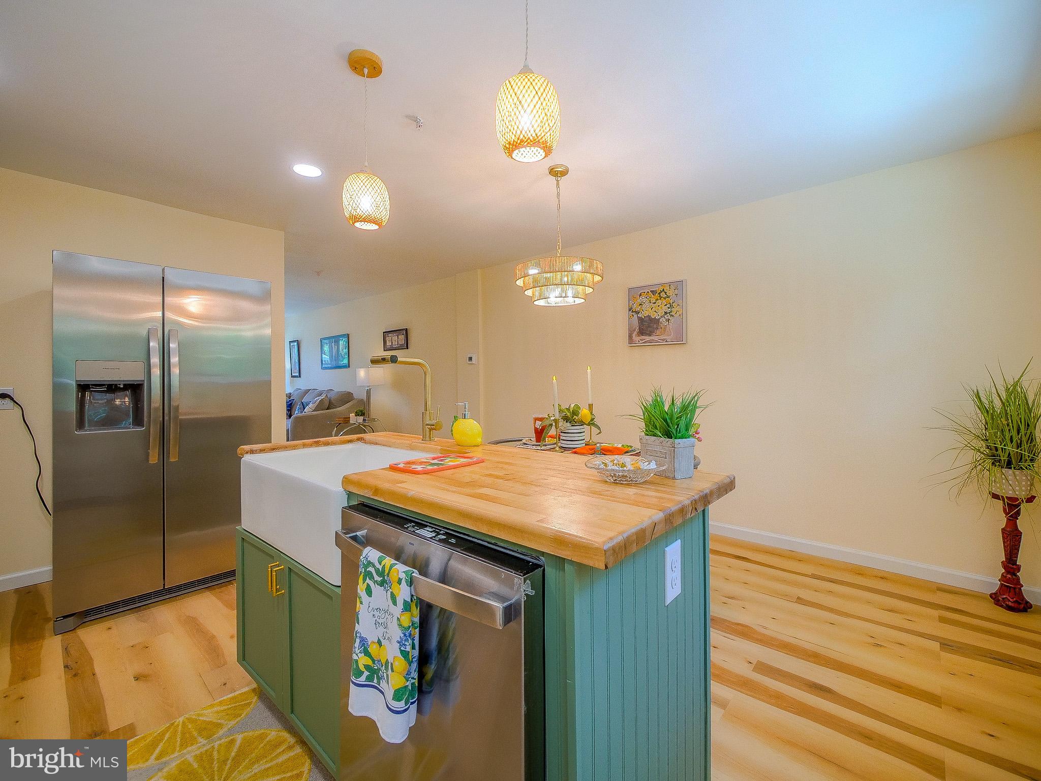 179 Madison Drive Newark, DE 19711 - Photo 18 of 43 a kitchen with stainless steel appliances granite countertop a sink a refrigerator and a stove