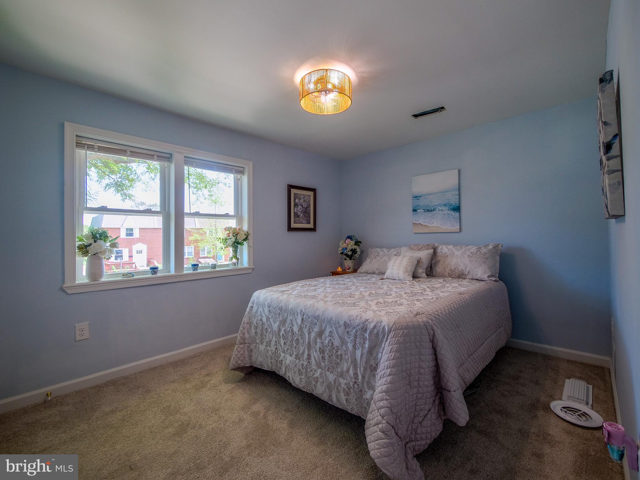 179 Madison Drive Newark, DE 19711 - Photo 21 of 43 a bed sitting in a bedroom next to a window