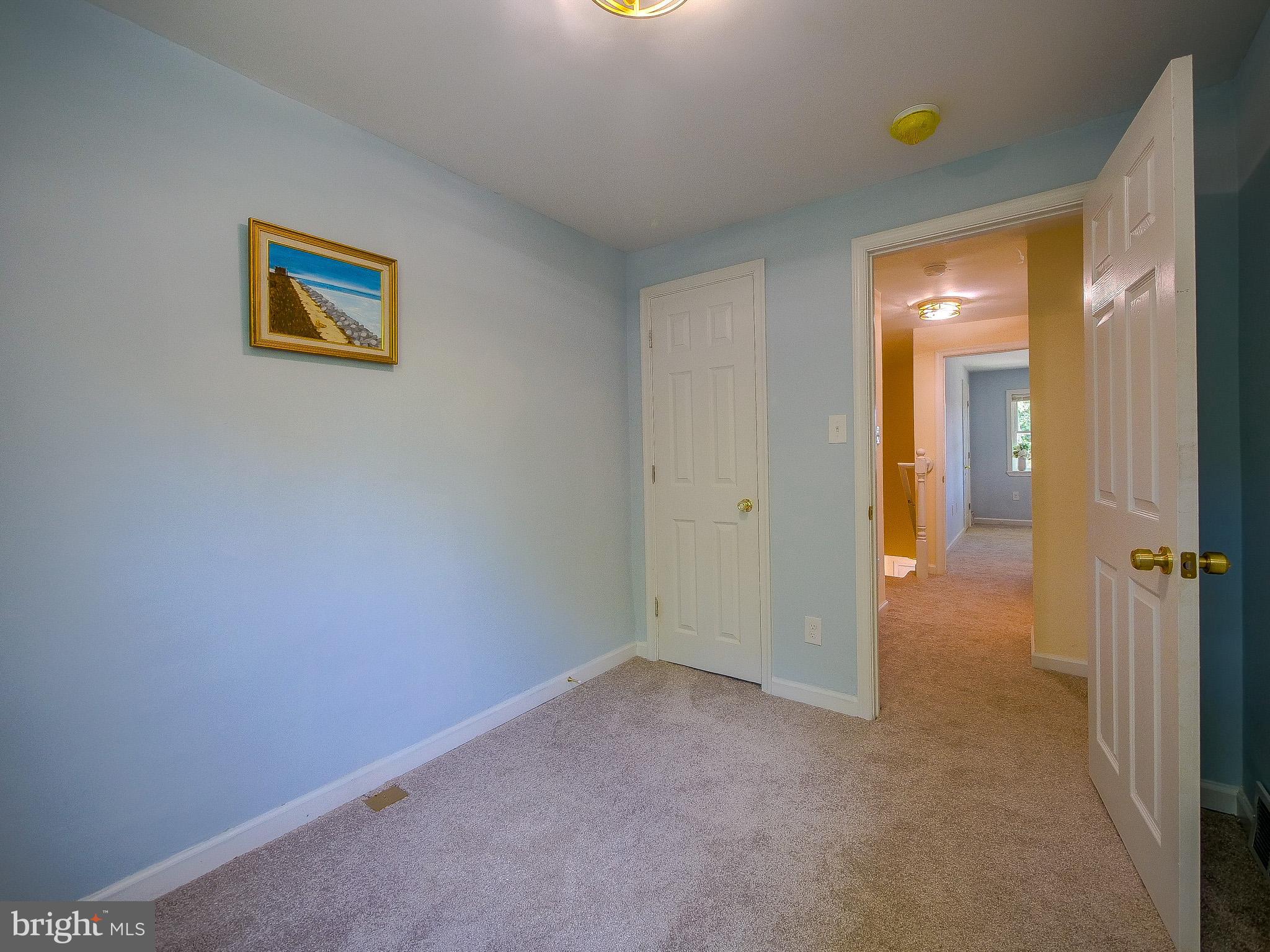 179 Madison Drive Newark, DE 19711 - Photo 28 of 43 a view of a hallway with painted walls