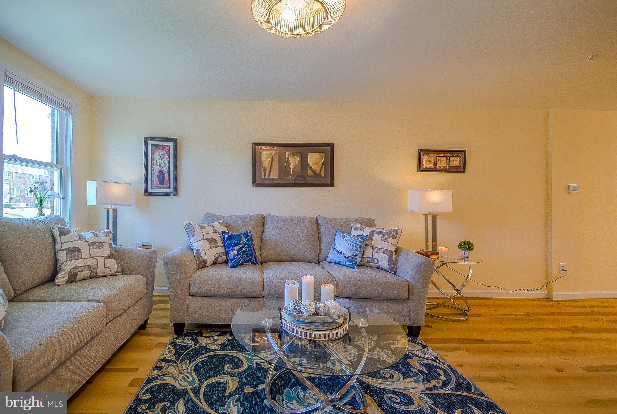 179 Madison Drive Newark, DE 19711 - Photo 5 of 43 a living room with furniture and a view of kitchen