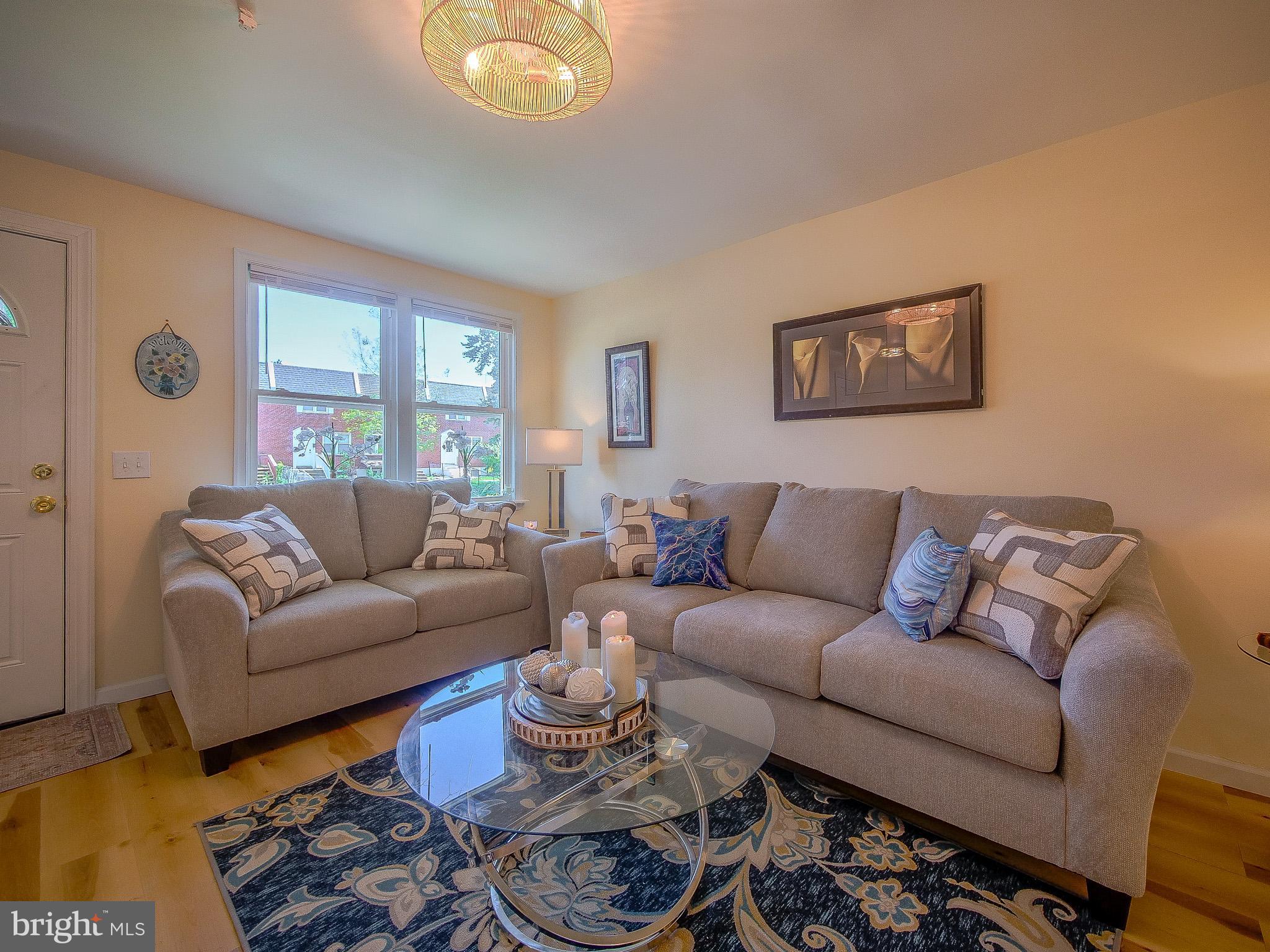 179 Madison Drive Newark, DE 19711 - Photo 6 of 43 a living room with furniture a rug and wall painting