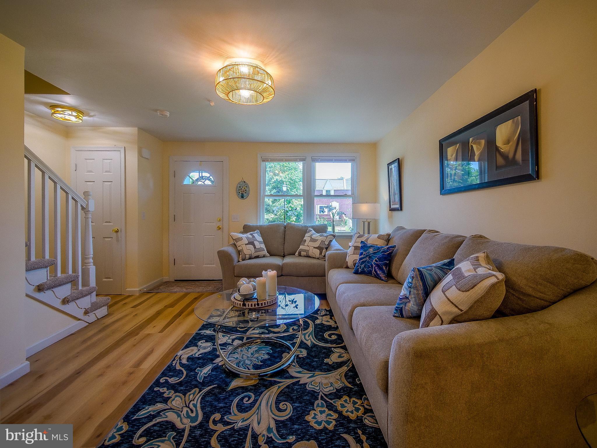 179 Madison Drive Newark, DE 19711 - Photo 7 of 43 a living room with furniture a rug and a window