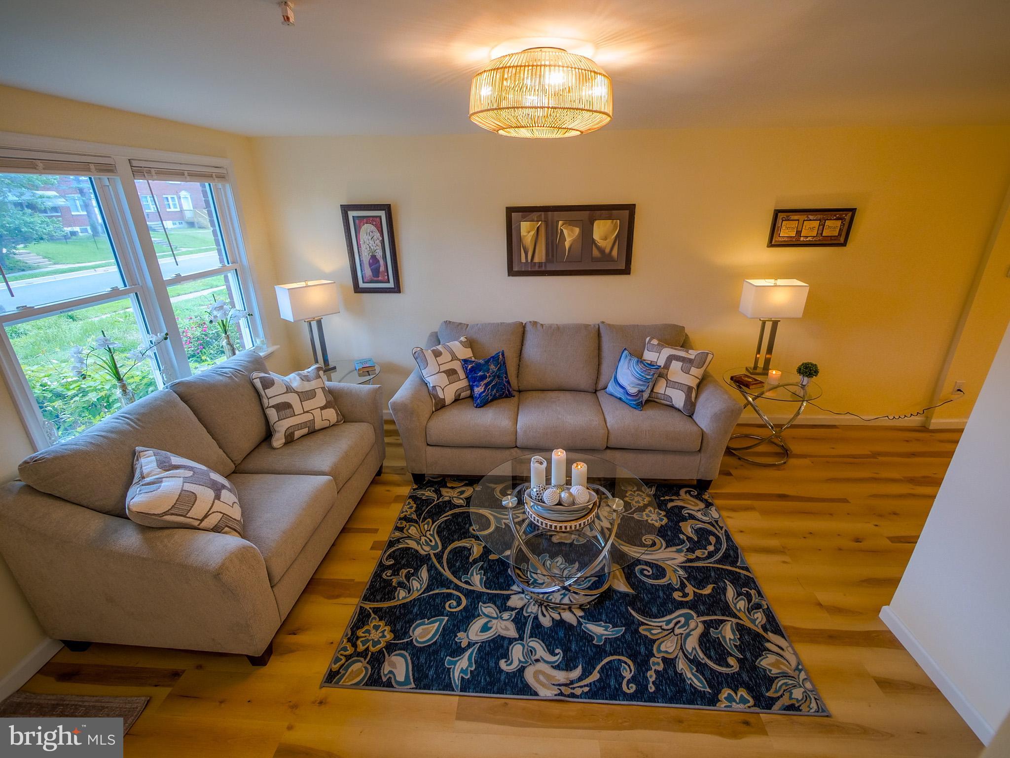 179 Madison Drive Newark, DE 19711 - Photo 9 of 43 a living room with furniture and a large window