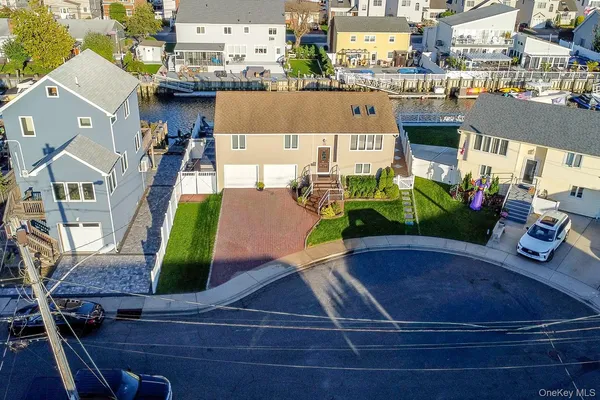 an aerial view of a house with a garden and plants