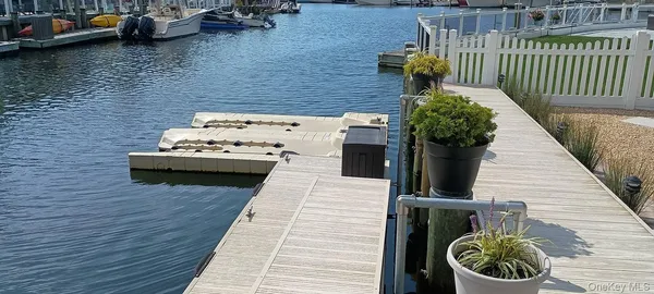 a terrace with outdoor seating and wooden floor