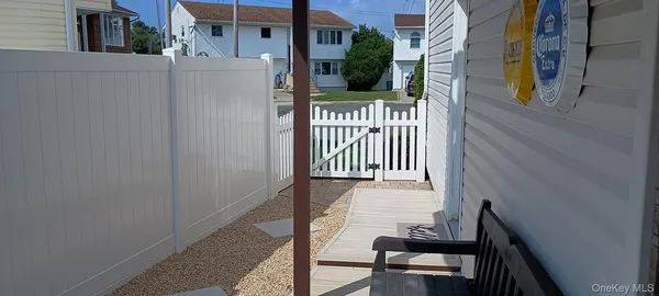a view of a house with a small deck
