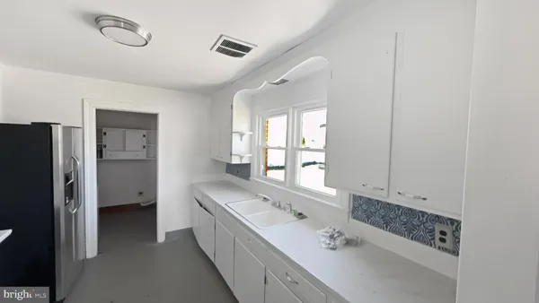 a bathroom with a double vanity sink and mirror
