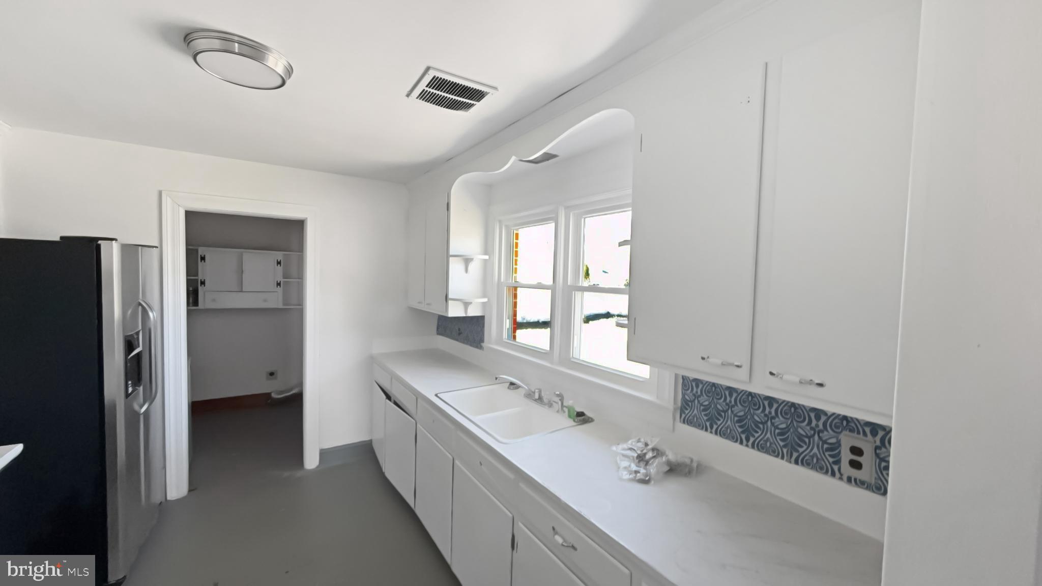 13 Nanticoke Road Cambridge, MD 21613 - Photo 2 of 14 a bathroom with a double vanity sink and mirror