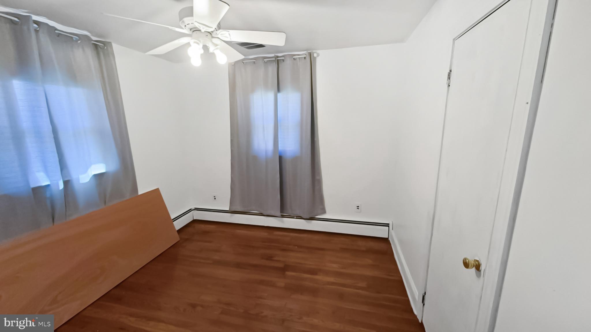 13 Nanticoke Road Cambridge, MD 21613 - Photo 4 of 14 a view of room with hardwood floor and a ceiling fan