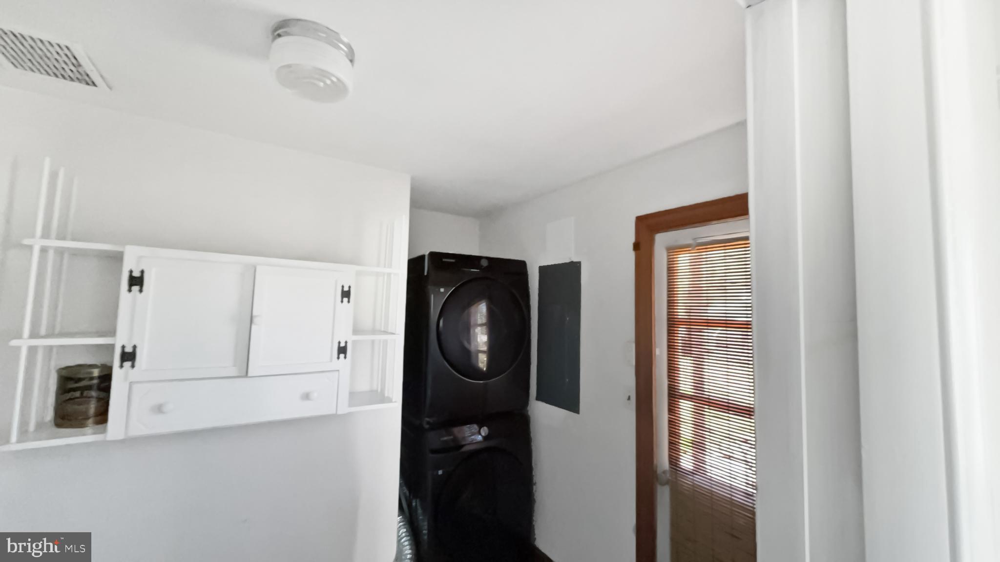13 Nanticoke Road Cambridge, MD 21613 - Photo 7 of 14 a bathroom with a walk in closet and mirror in closet