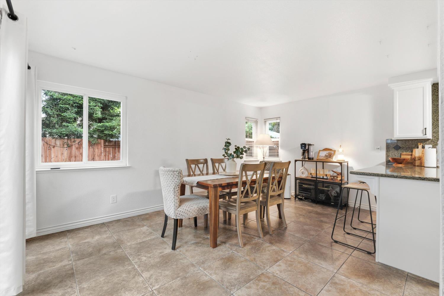 8117 Prior Way Antelope, CA 95843 - Photo 11 of 27 a dining room with furniture and window