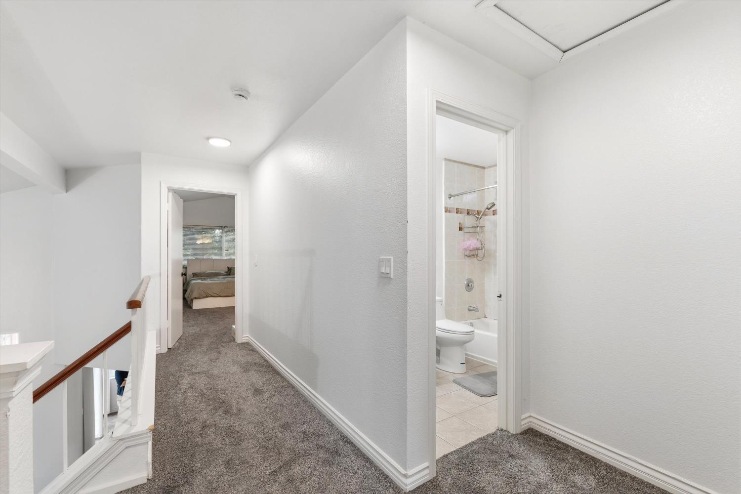 8117 Prior Way Antelope, CA 95843 - Photo 17 of 27 a view of a hallway with wooden shelves