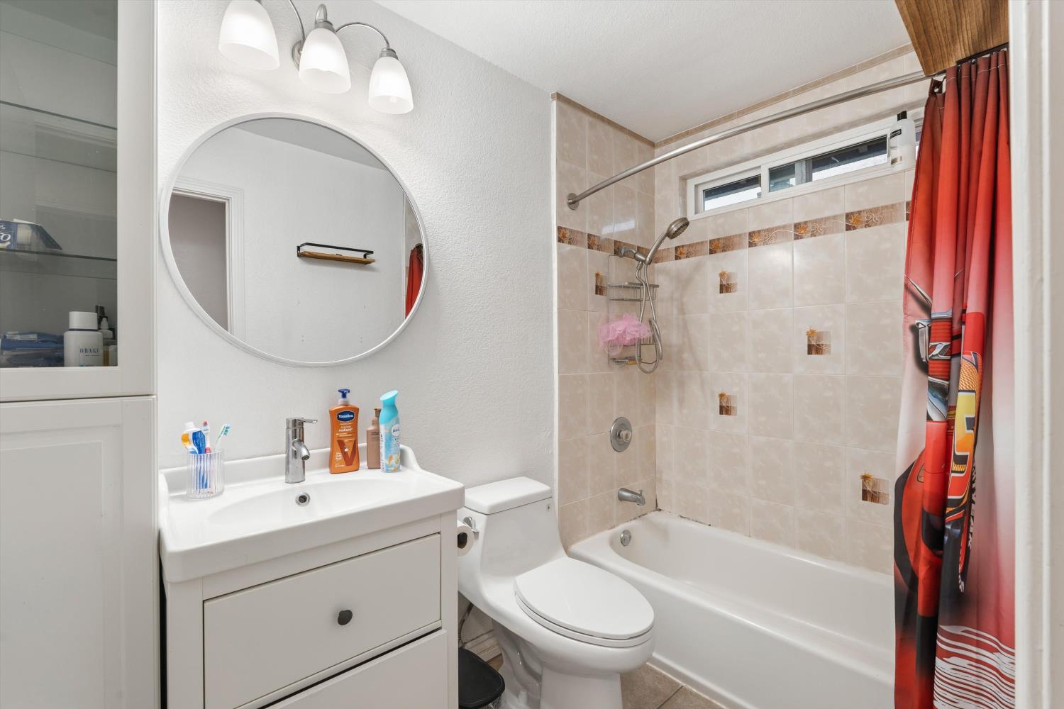 8117 Prior Way Antelope, CA 95843 - Photo 18 of 27 a bathroom with a sink a toilet and a mirror
