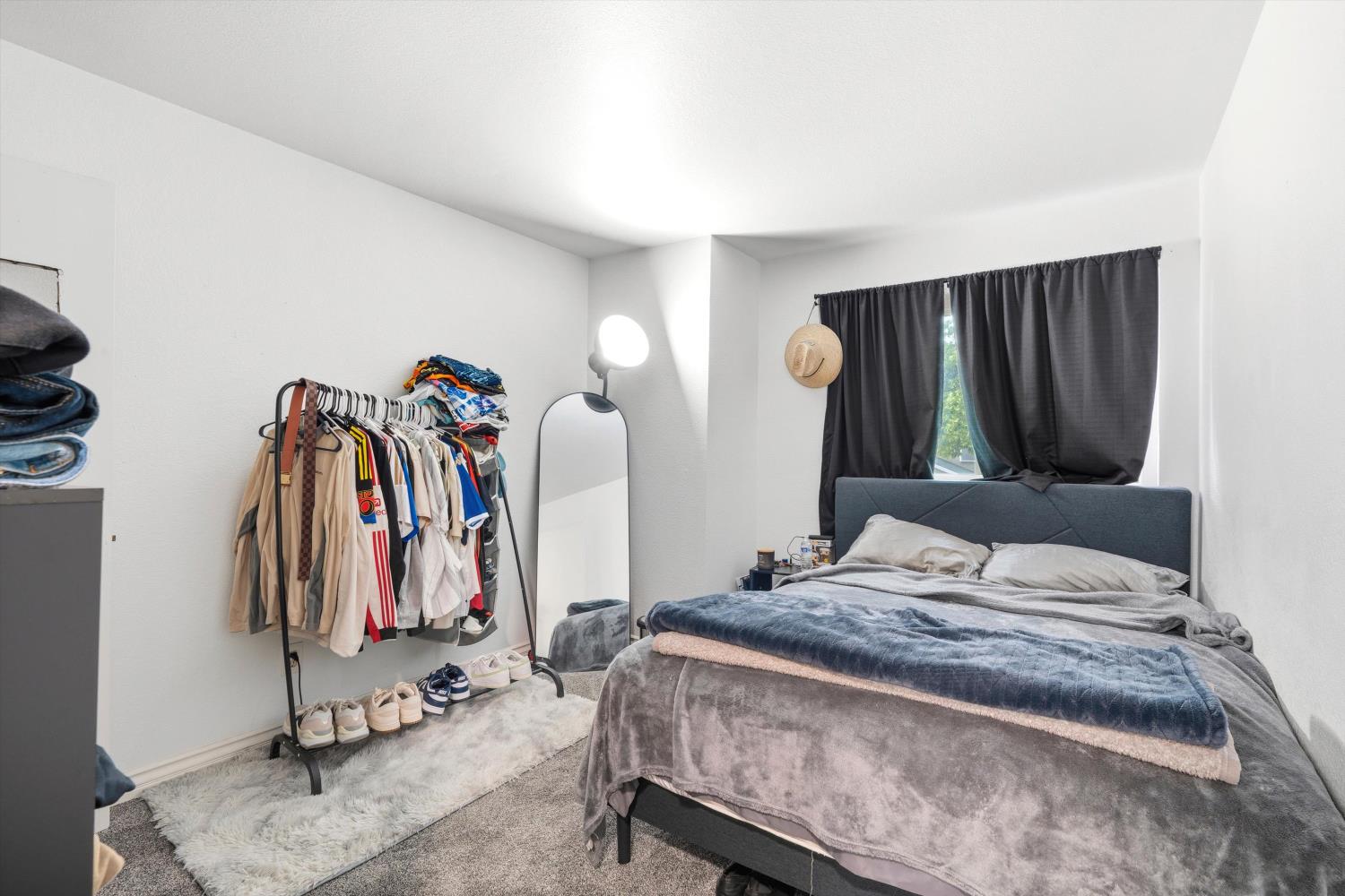 8117 Prior Way Antelope, CA 95843 - Photo 19 of 27 a bedroom with a bed and a mirror
