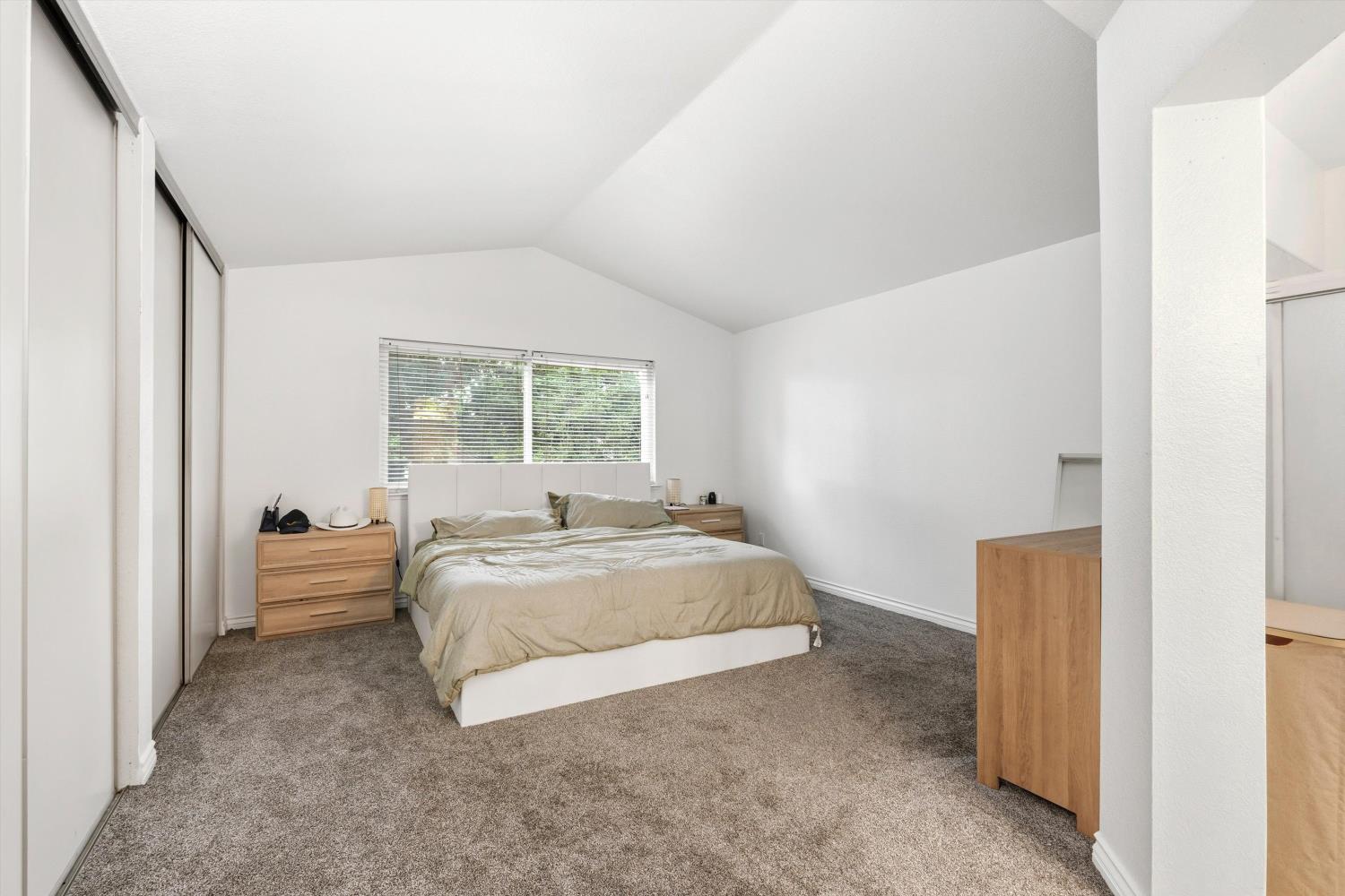 8117 Prior Way Antelope, CA 95843 - Photo 21 of 27 a spacious bedroom with a bed and a window